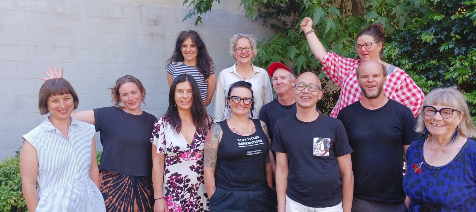 picture of 11 Sydney cohousing members of different ages and ethnic backgrounds, smiling